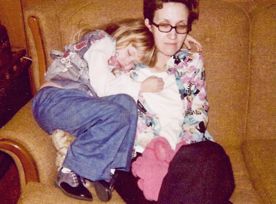 Mother with young daughter on couch